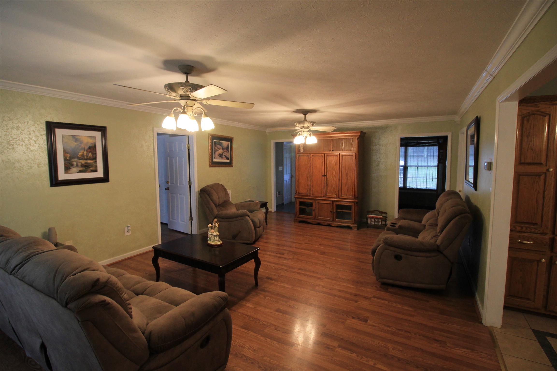 7956 Enterprise Road Mount Pleasant, TN 38474 - Photo 11 of 30 The spacious living room. Note the warmly glowing floor.