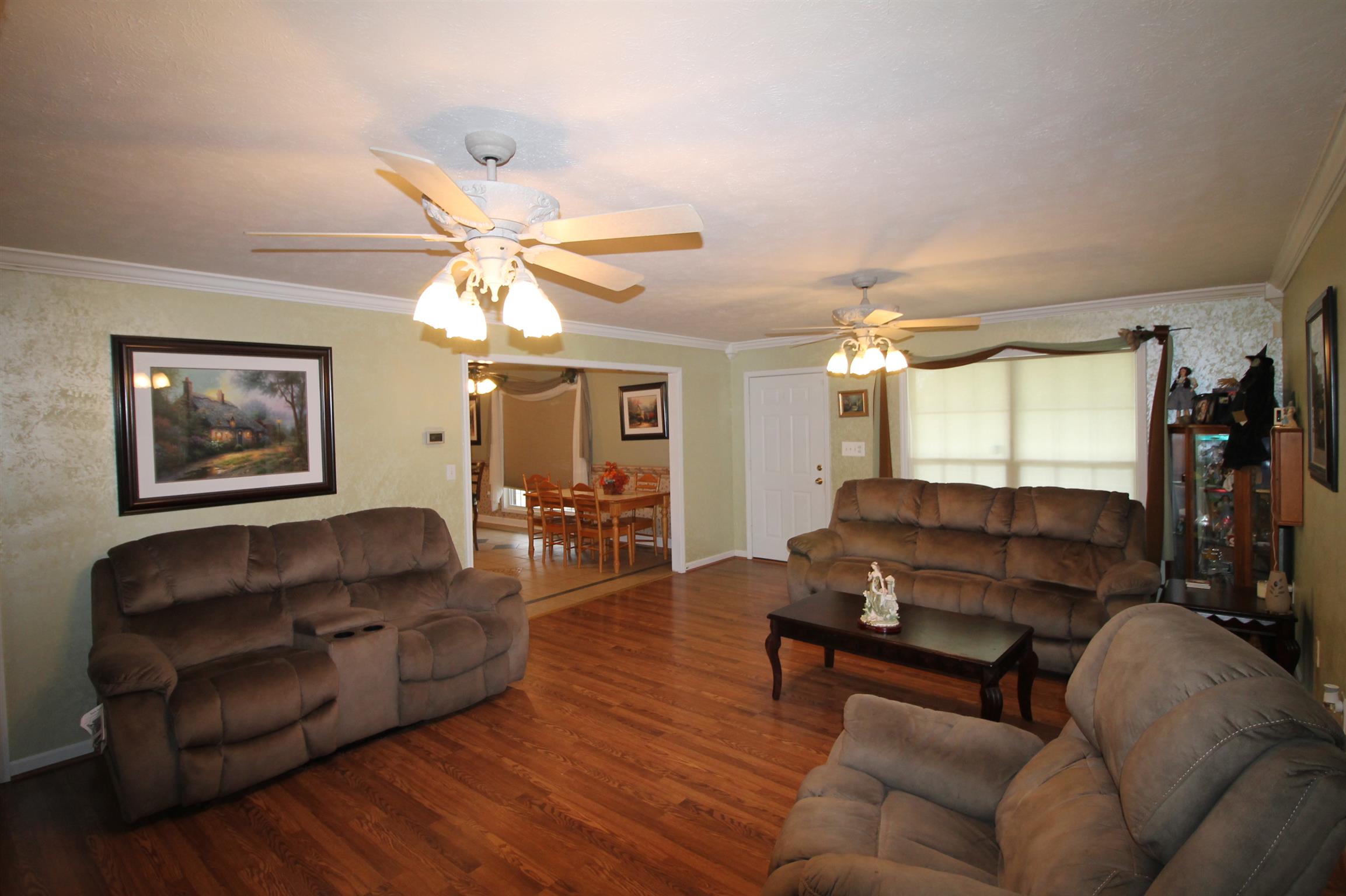 7956 Enterprise Road Mount Pleasant, TN 38474 - Photo 13 of 30 This living room shot shows the entrance to the kitchen.