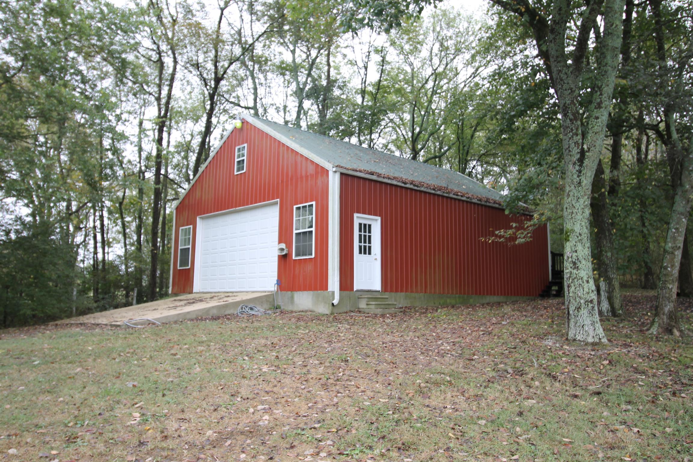 This detached garage/barn will hold whatever you need, and there's a second-floor storage space with its own private entry.
