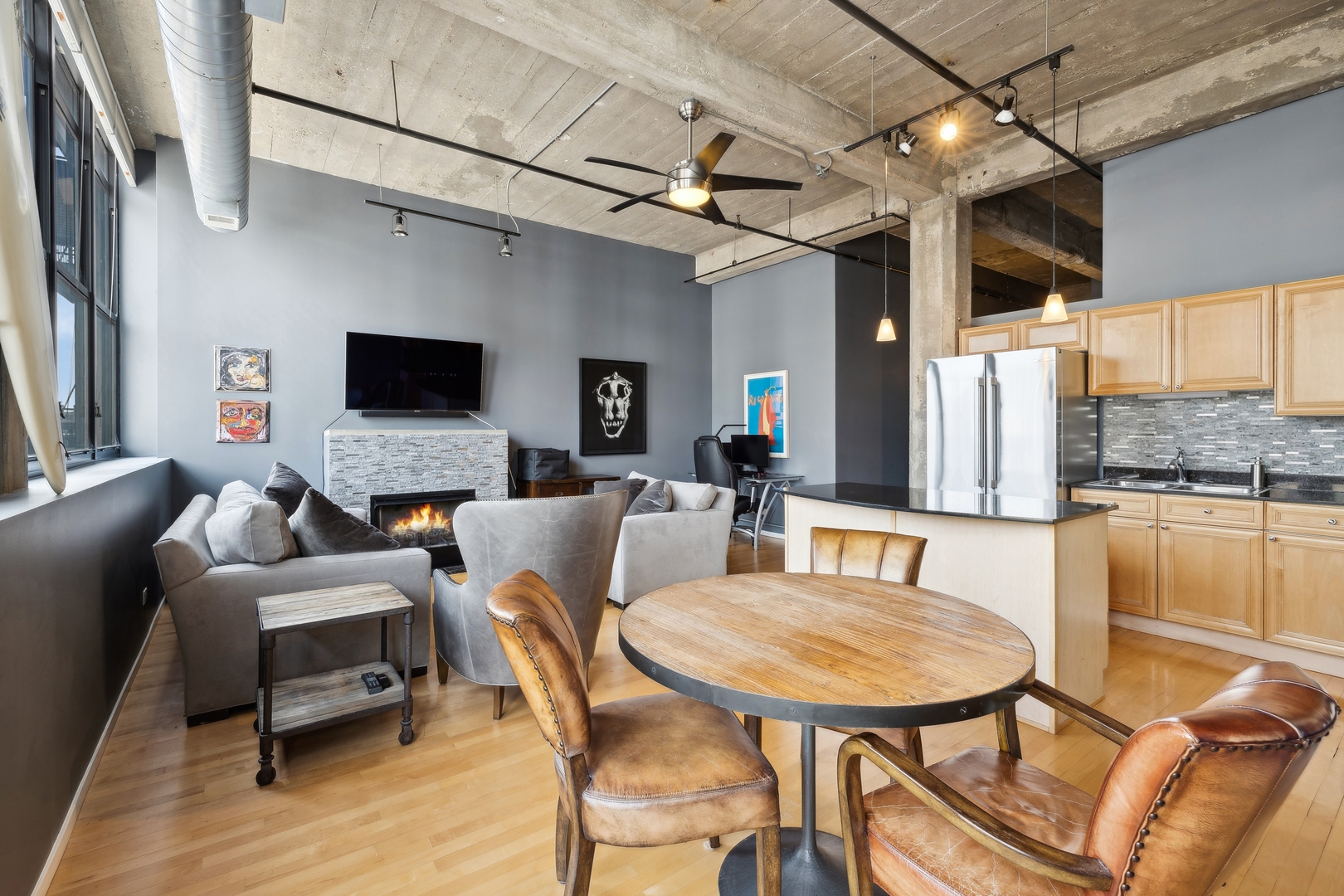 843 West Adams Street, Unit 606 Chicago, IL 60607 - Photo 4 of 12 a living room with furniture and a flat screen tv