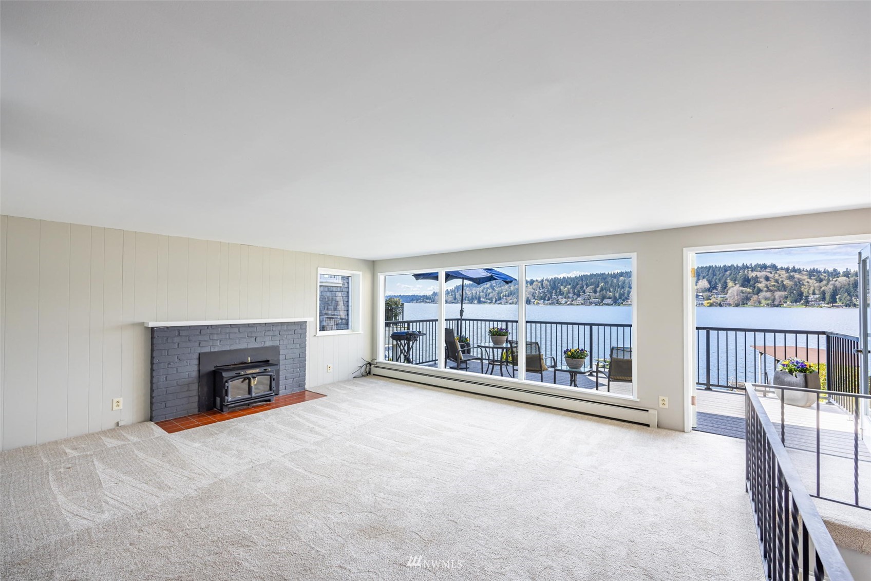 6631 Ripley Ln S East Renton, WA 98056 - Photo 13 of 34 an empty room with fireplace and a large window