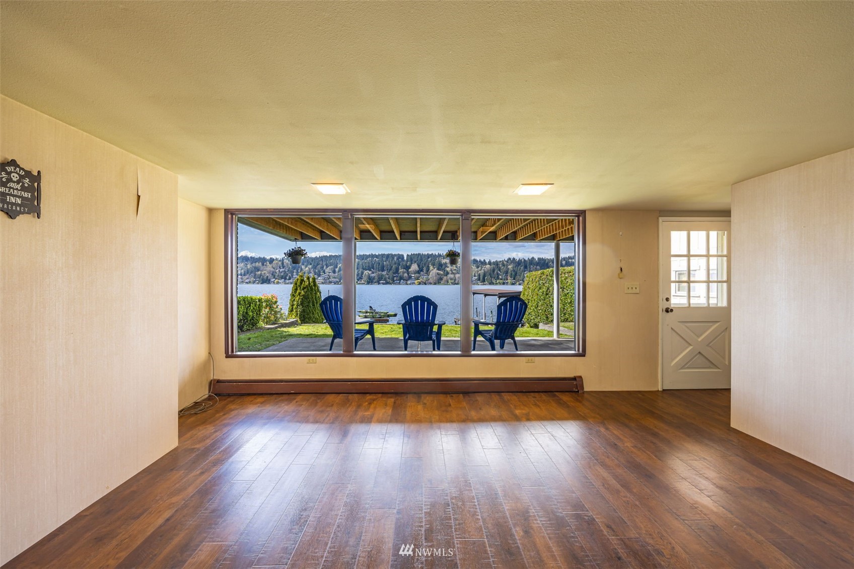 6631 Ripley Ln S East Renton, WA 98056 - Photo 15 of 34 wooden floor in an empty room with a window