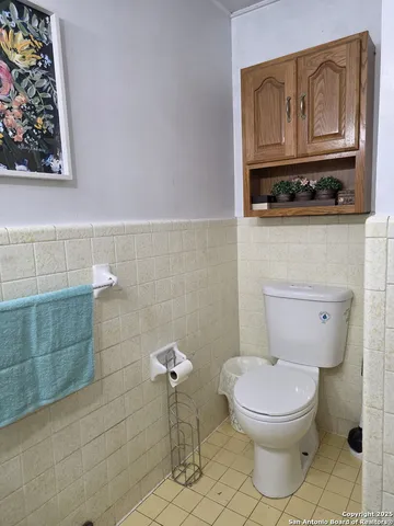 a bathroom with a toilet and a sink