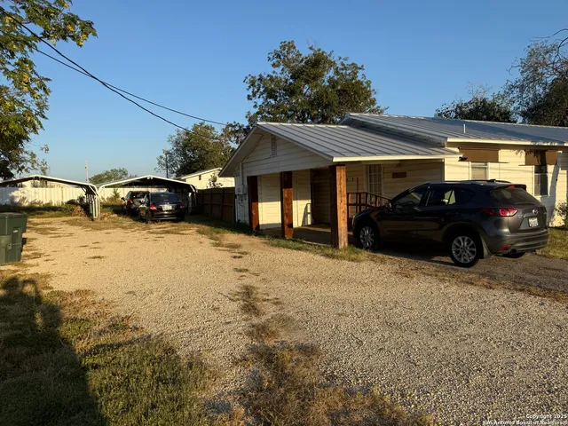 a view of a car parked in front of a house