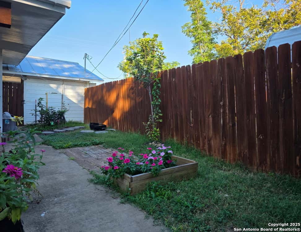 932 South Getty Street Uvalde, TX 78801 - Photo 3 of 17 a view of a potted flower in a yard with swimming pool