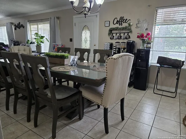 a view of a dining room with furniture