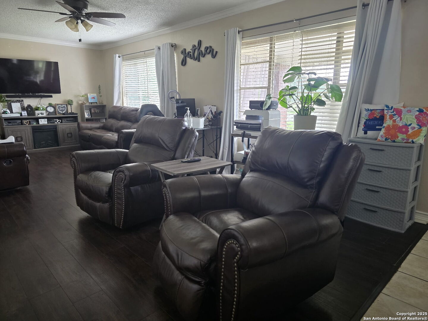 932 South Getty Street Uvalde, TX 78801 - Photo 6 of 17 a living room with furniture a flat screen tv and a window
