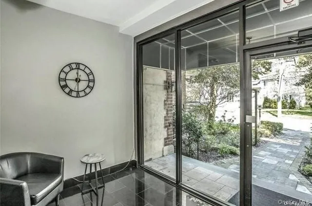 a view of room with window and furniture