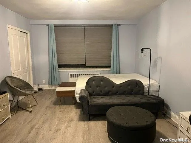 a living room with furniture and a mirror