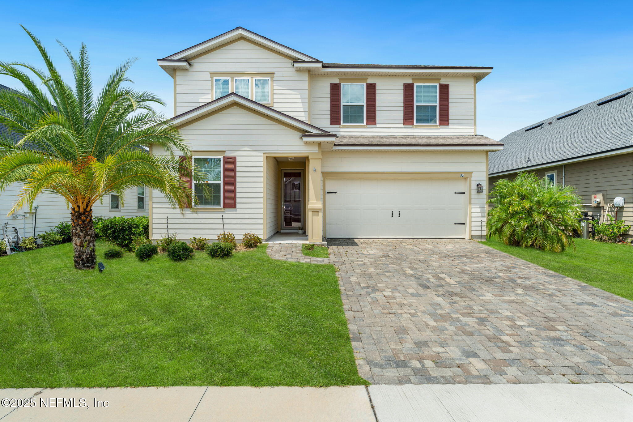 52 Opal Way St. Augustine, FL 32086 - Photo 1 of 55 a front view of a house with a yard and garage