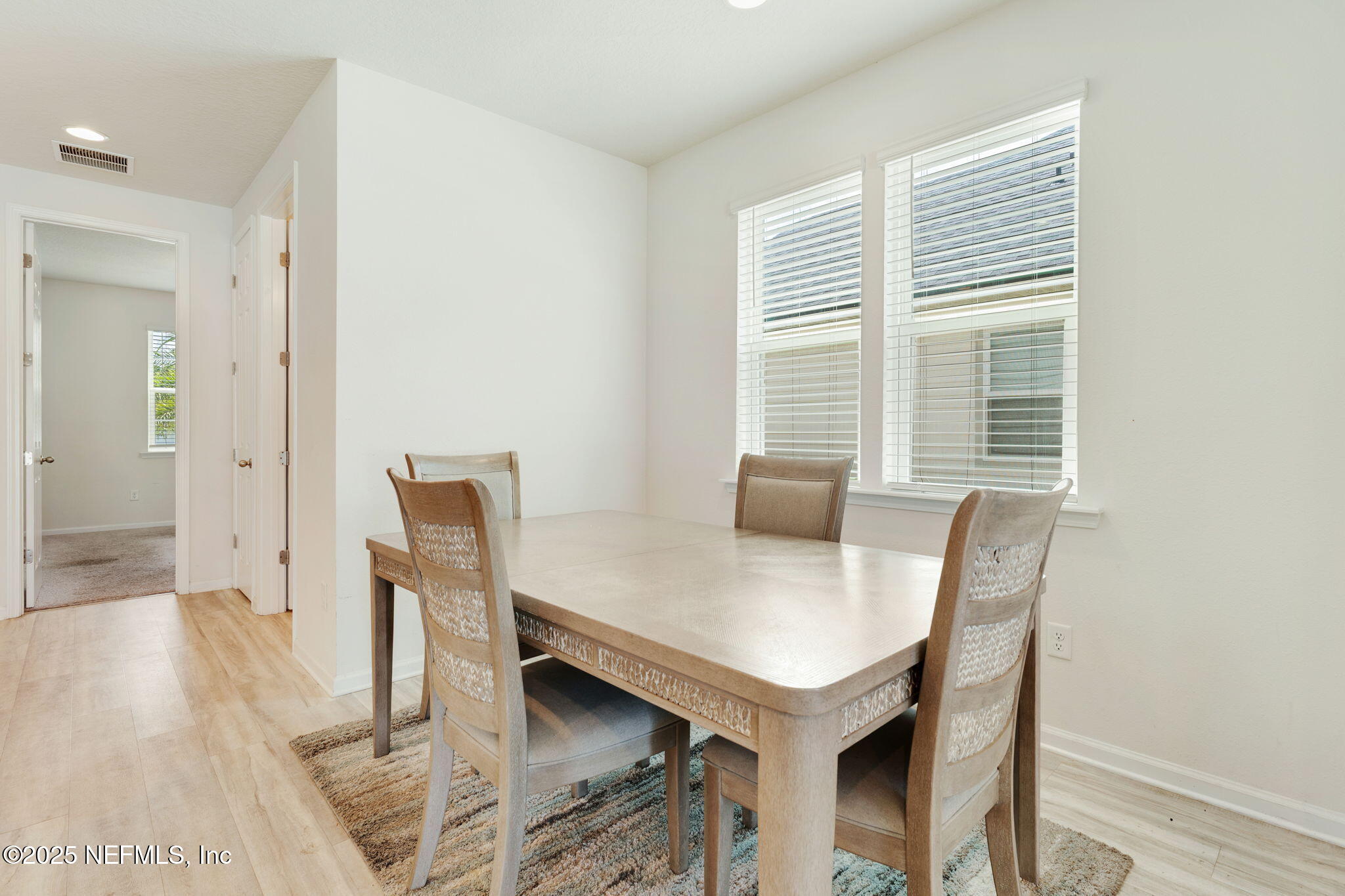 52 Opal Way St. Augustine, FL 32086 - Photo 11 of 55 a view of a dining room with furniture and wooden floor