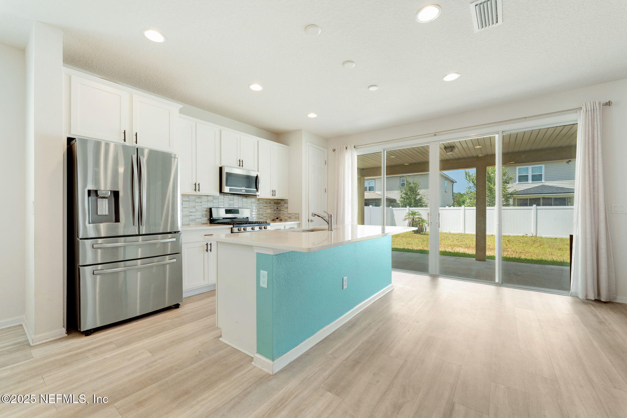 52 Opal Way St. Augustine, FL 32086 - Photo 12 of 55 a kitchen with stainless steel appliances granite countertop a refrigerator and a stove top oven