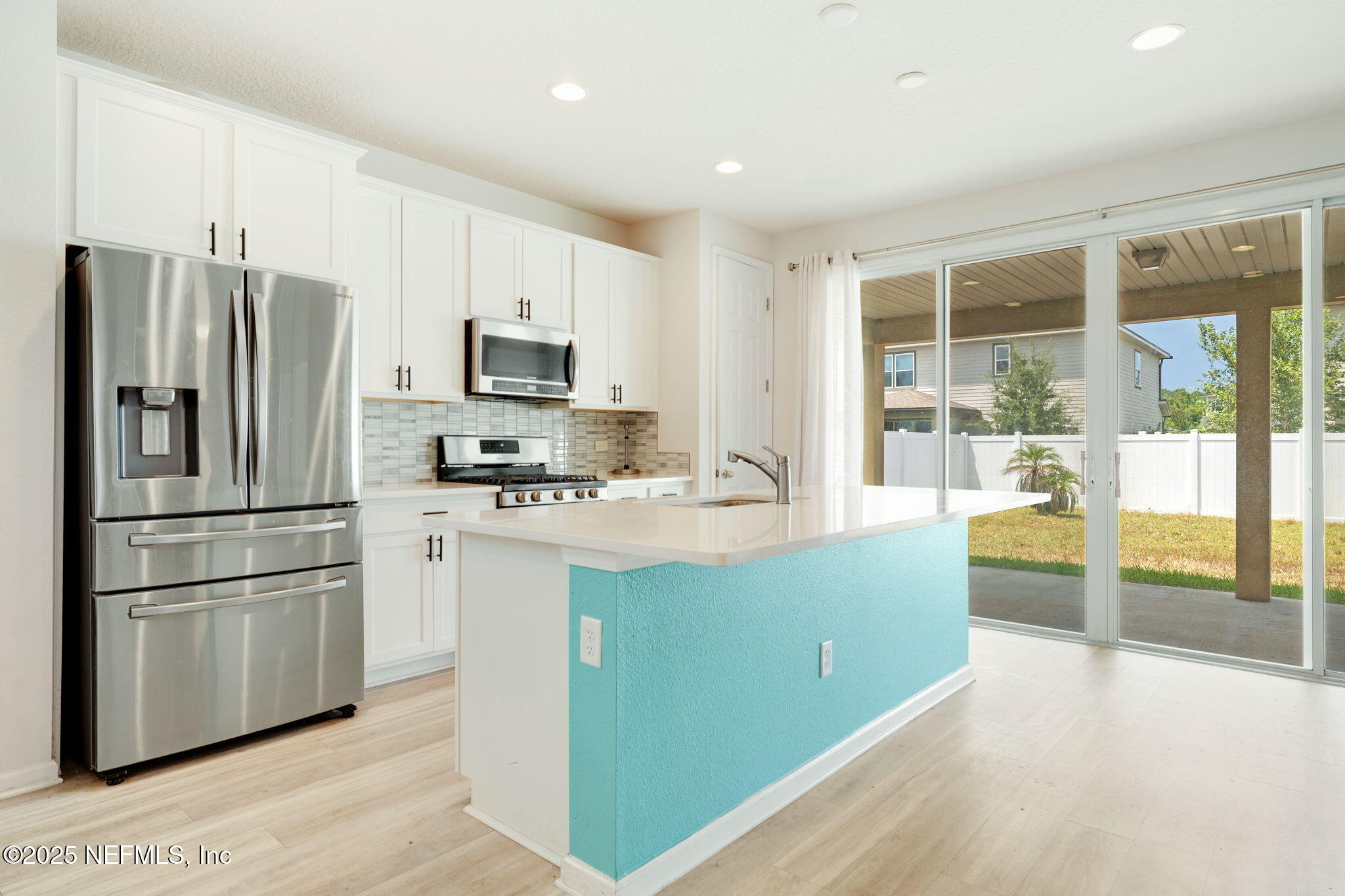 52 Opal Way St. Augustine, FL 32086 - Photo 13 of 55 a kitchen with stainless steel appliances granite countertop a refrigerator a stove a sink and a refrigerator