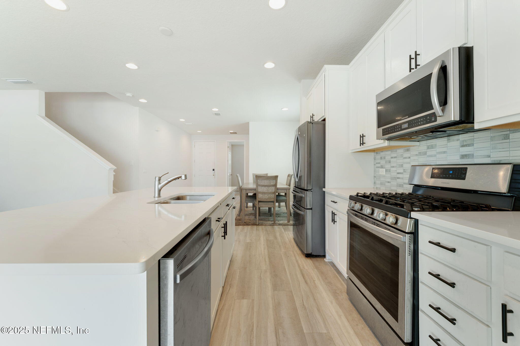 52 Opal Way St. Augustine, FL 32086 - Photo 15 of 55 a kitchen with a sink stove and microwave