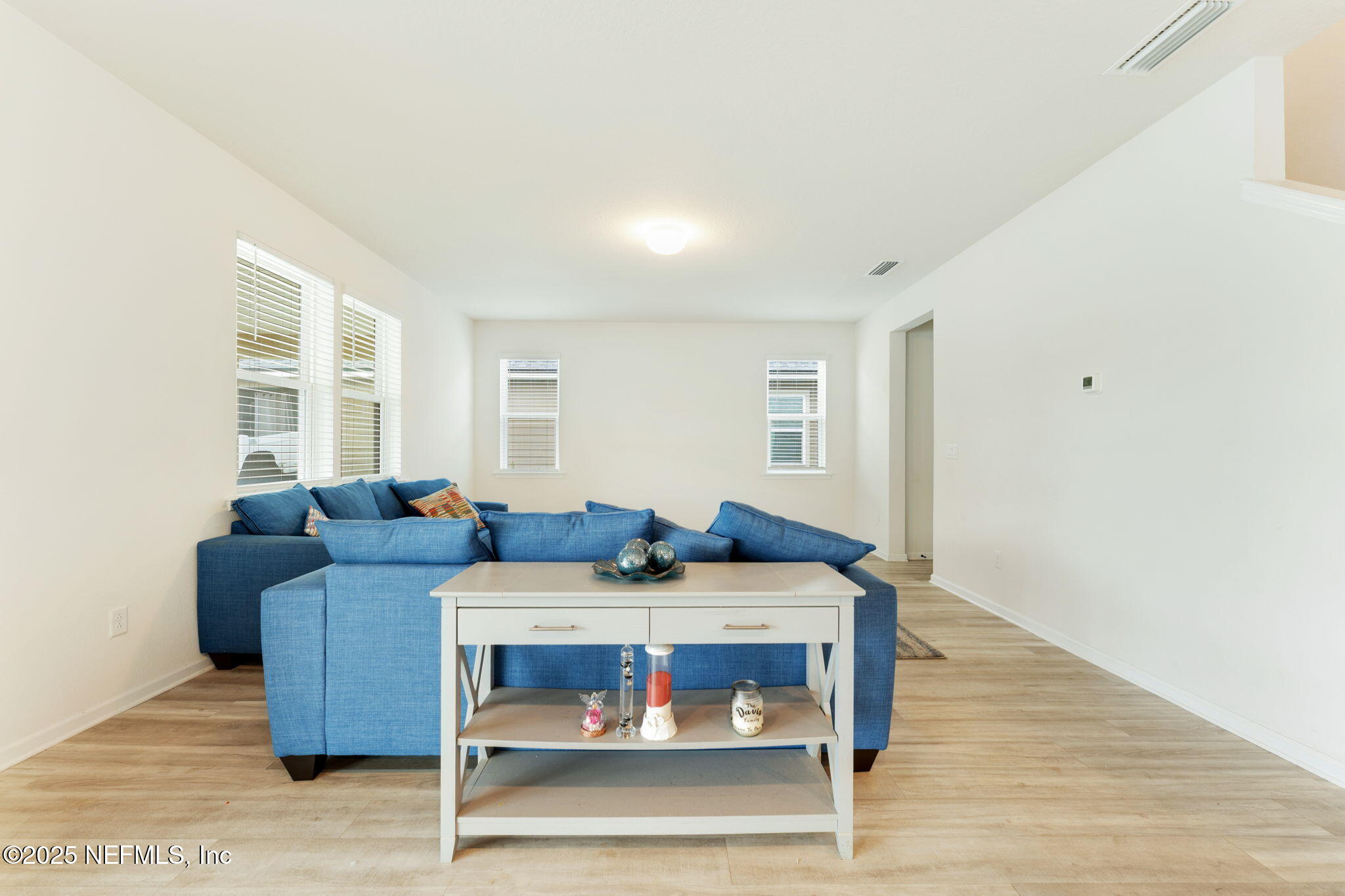 52 Opal Way St. Augustine, FL 32086 - Photo 20 of 55 a living room with furniture and a wooden floor