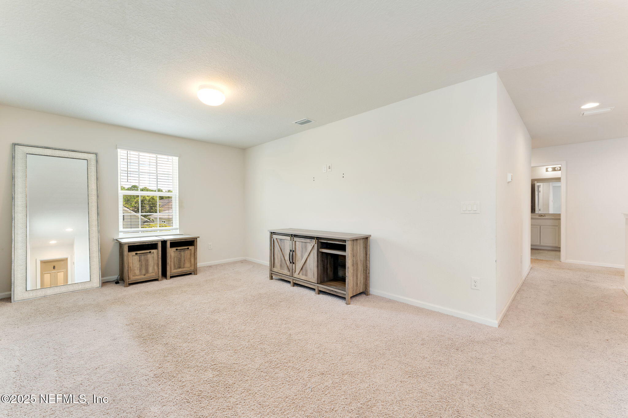 52 Opal Way St. Augustine, FL 32086 - Photo 29 of 55 an empty room with windows and ceiling fan