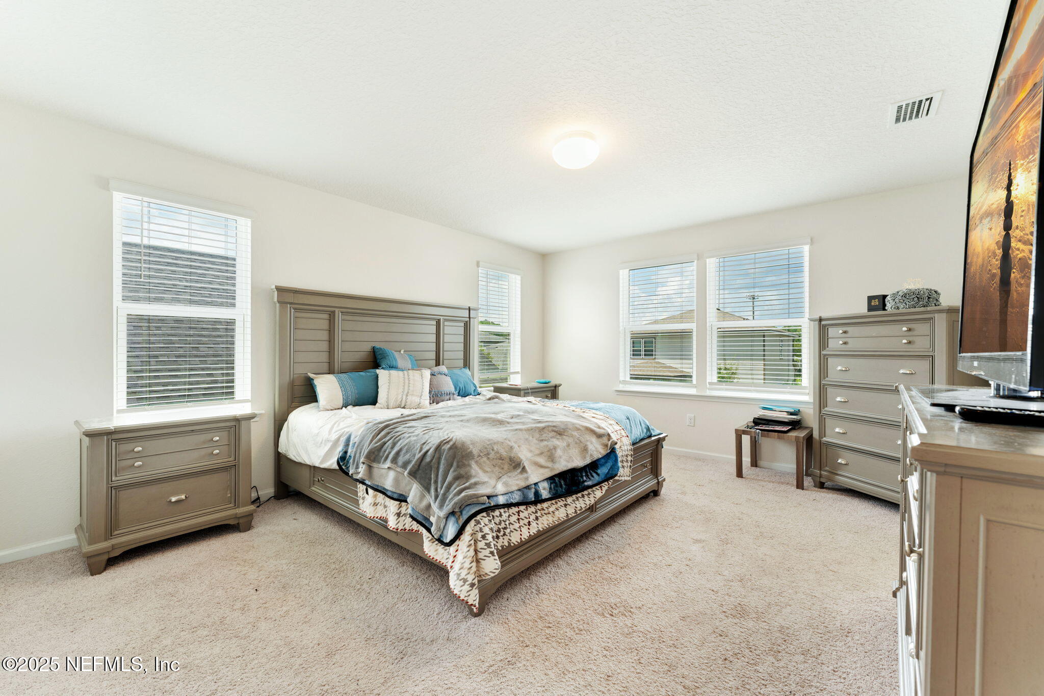 52 Opal Way St. Augustine, FL 32086 - Photo 30 of 55 a bed sitting in a spacious bedroom next to a window