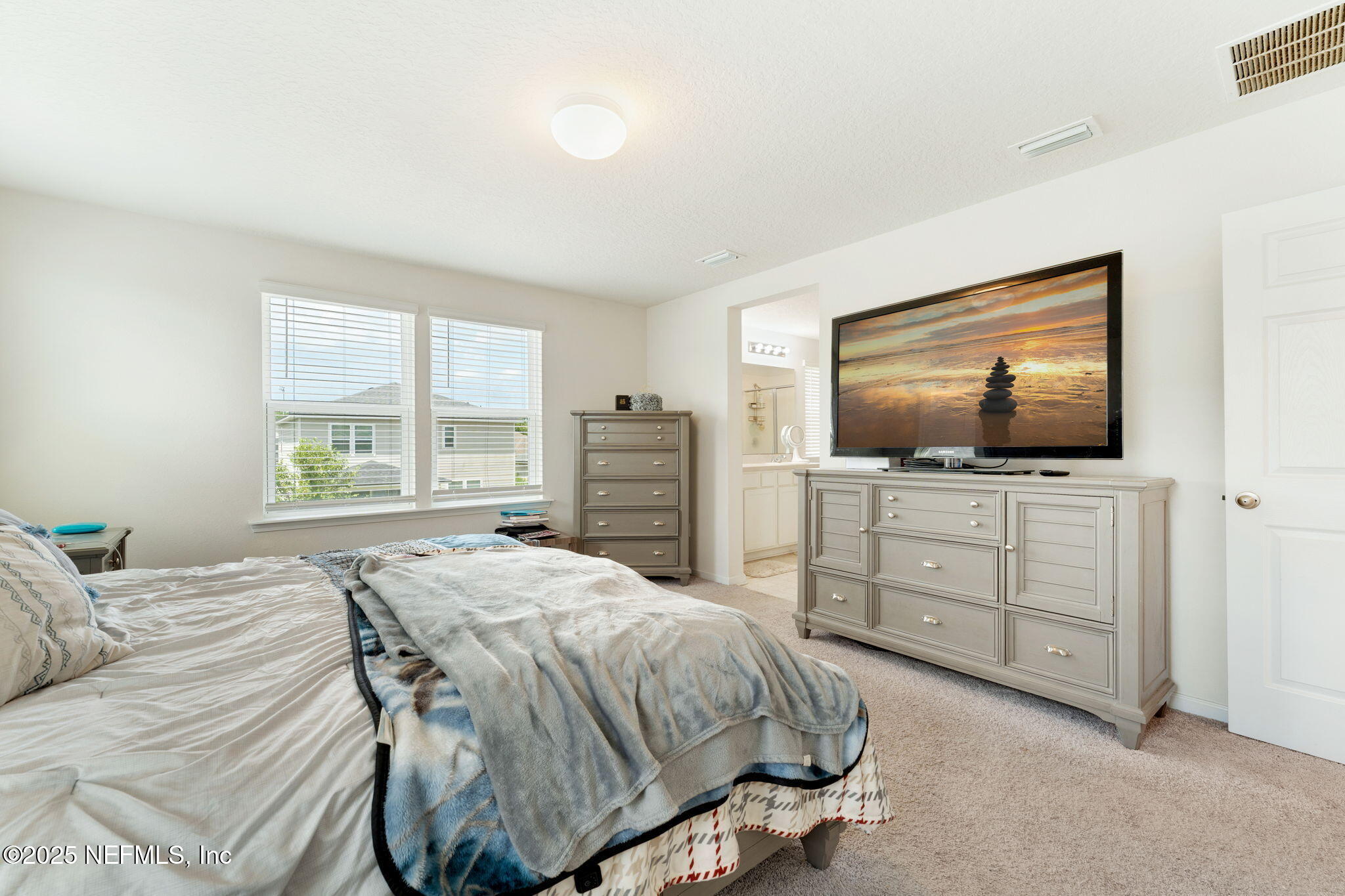 52 Opal Way St. Augustine, FL 32086 - Photo 31 of 55 a bedroom with a bed and a flat screen tv on dresser