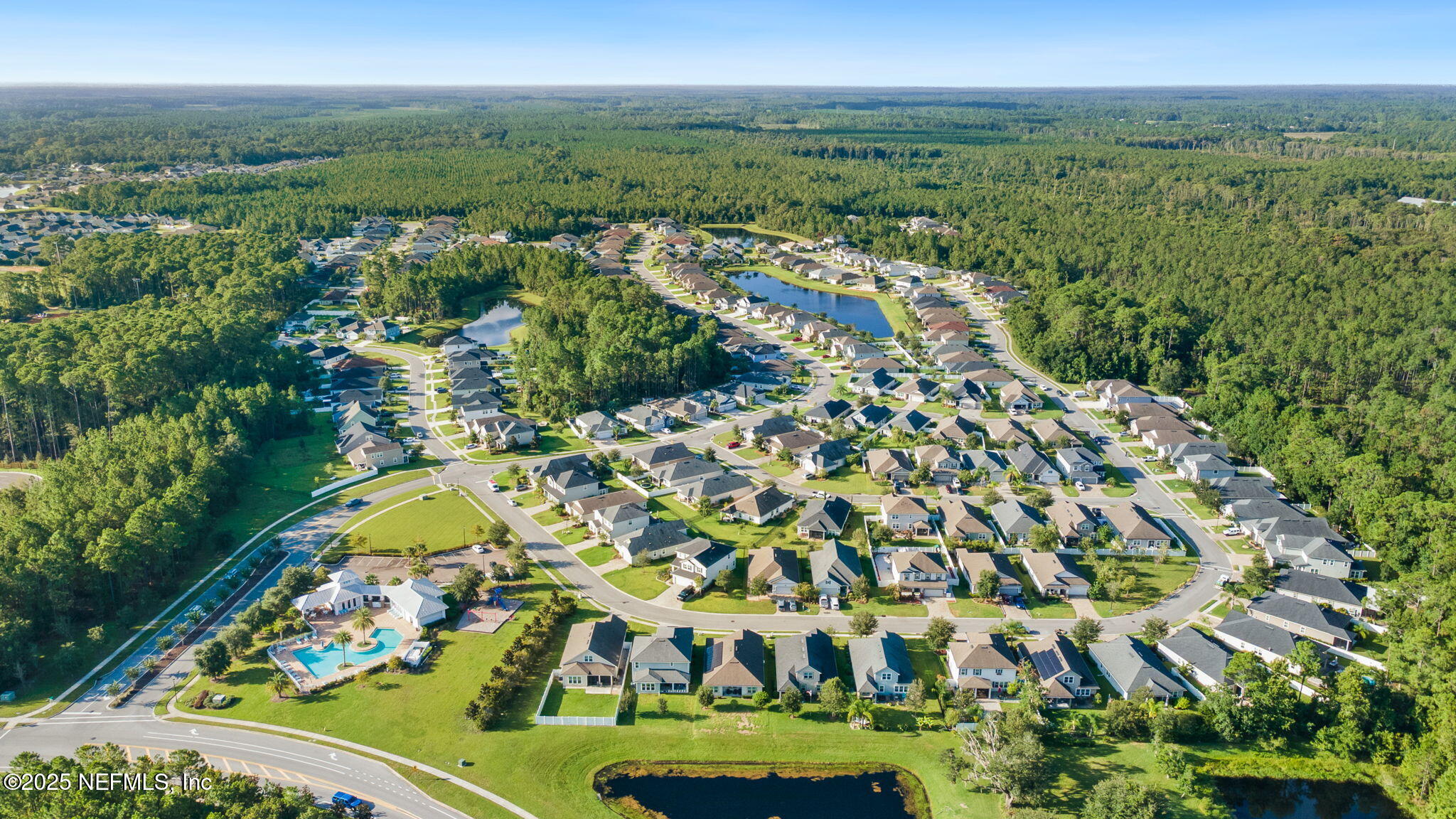 52 Opal Way St. Augustine, FL 32086 - Photo 48 of 55 an aerial view of a residential houses with outdoor space and trees all around