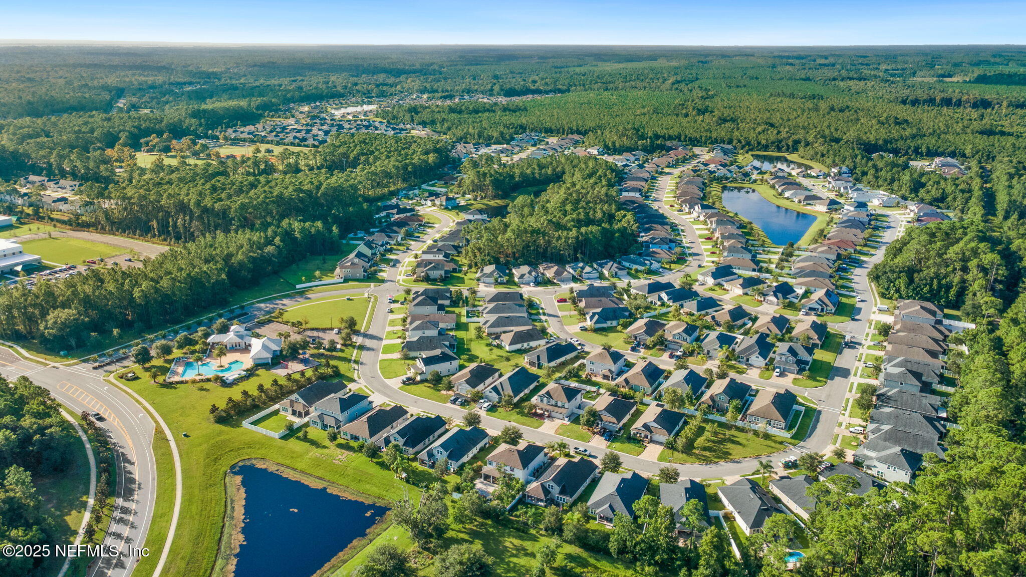 52 Opal Way St. Augustine, FL 32086 - Photo 49 of 55 an aerial view of residential houses with outdoor space and trees