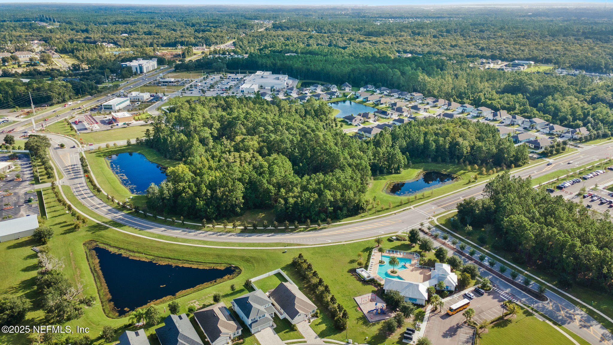 52 Opal Way St. Augustine, FL 32086 - Photo 51 of 55 a view of a lake with a garden