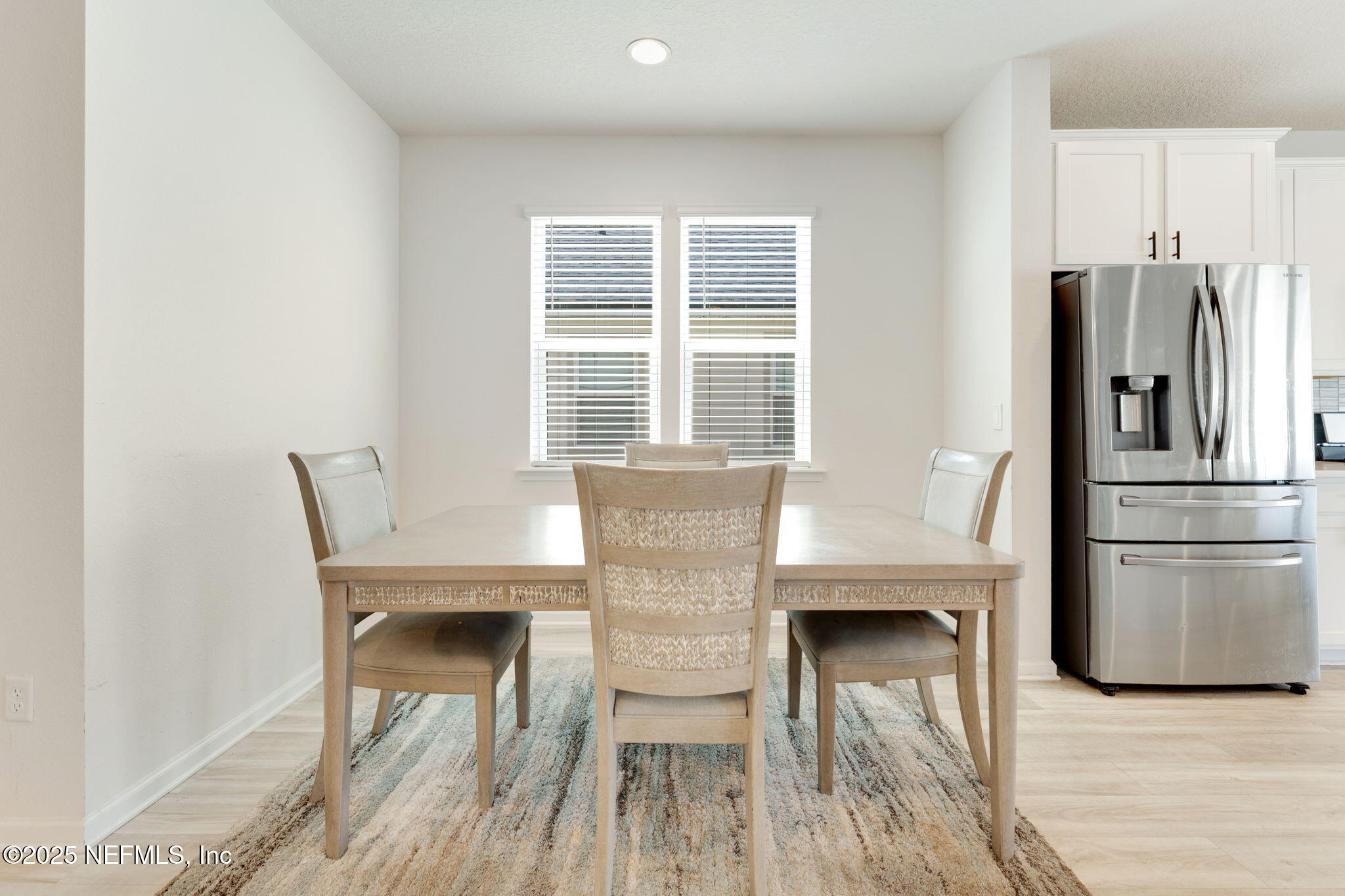 52 Opal Way St. Augustine, FL 32086 - Photo 10 of 55 a kitchen with granite countertop white cabinets and stainless steel appliances