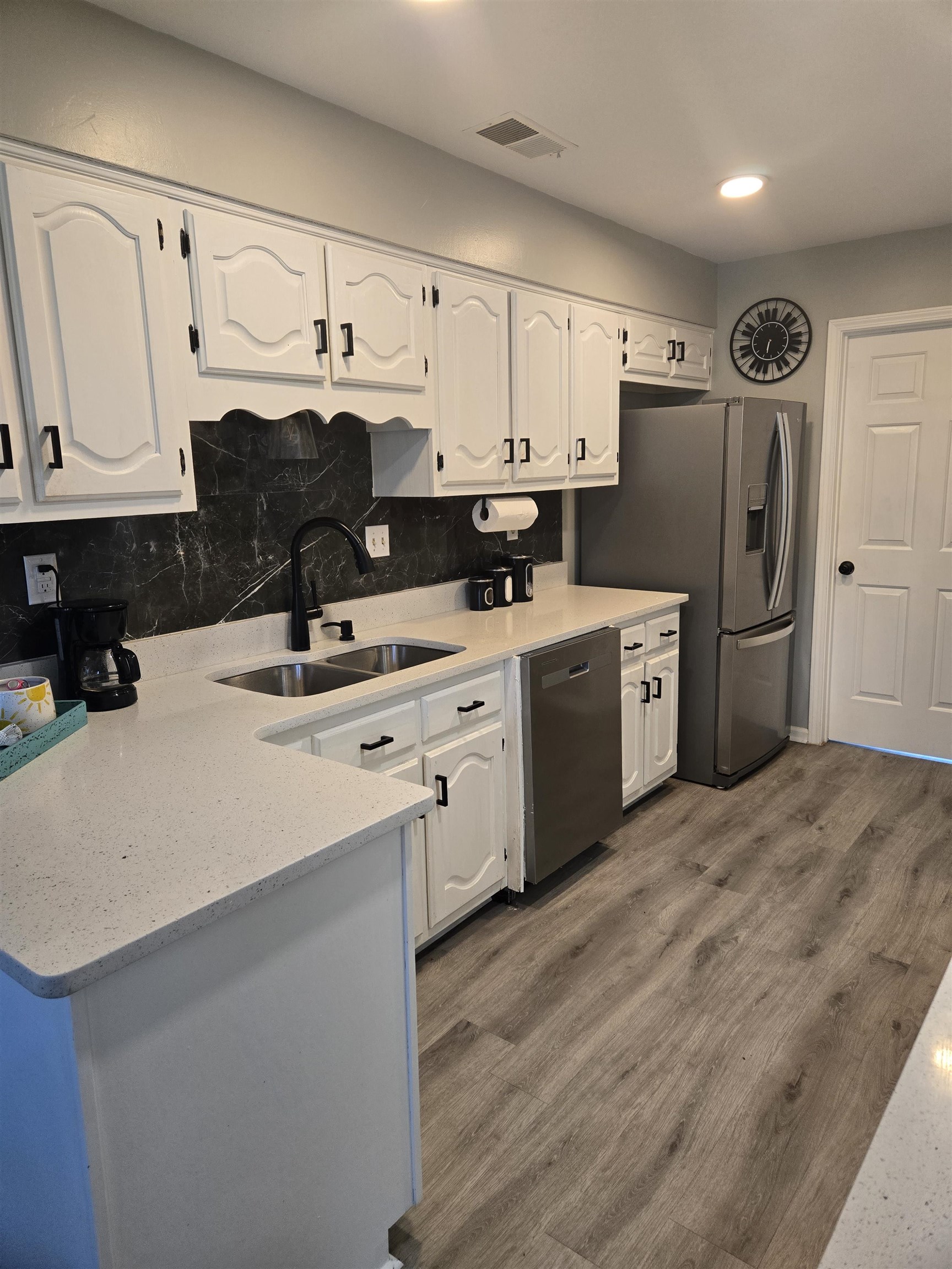 3950 Bobby Jones Road Memphis, TN 38125 - Photo 13 of 21 Kitchen featuring a sink, stainless steel appliances, and white cabinetry