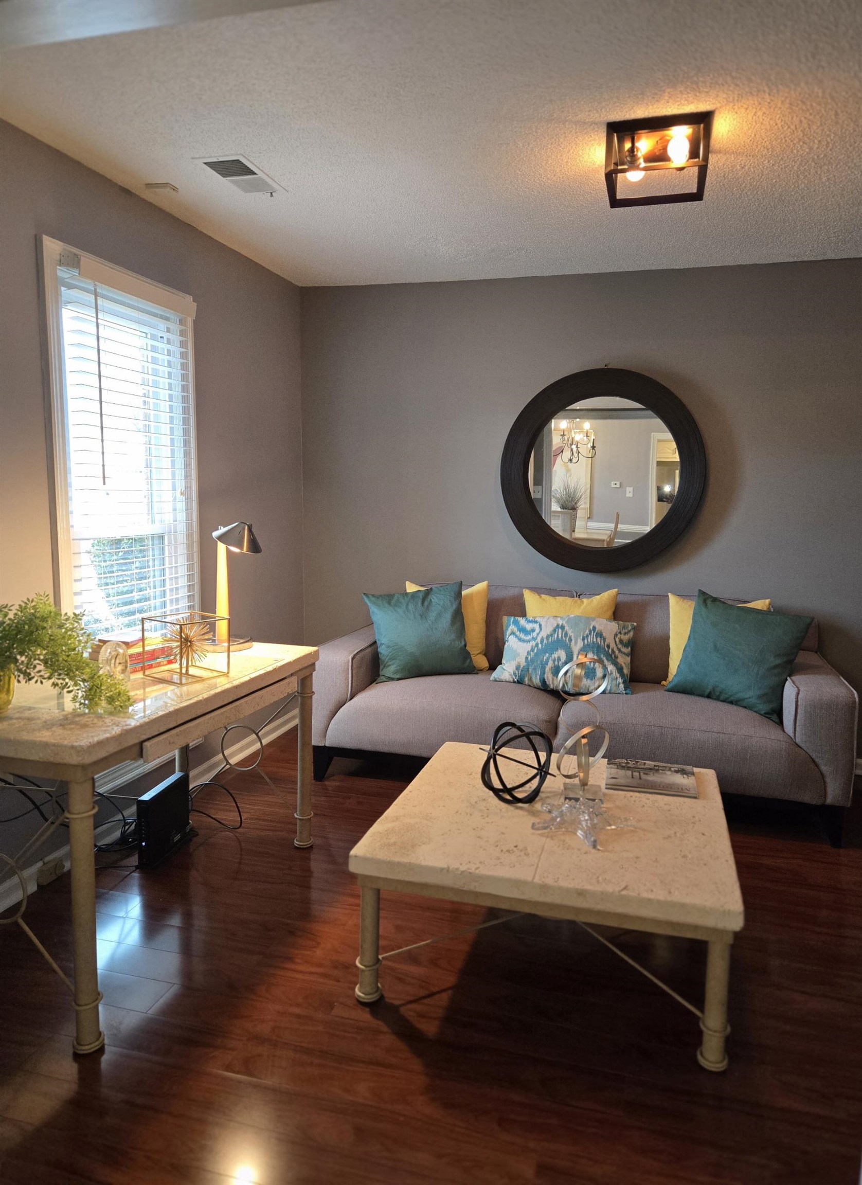 3950 Bobby Jones Road Memphis, TN 38125 - Photo 6 of 21 Living room with a textured ceiling, dark wood-style floors, and visible vents