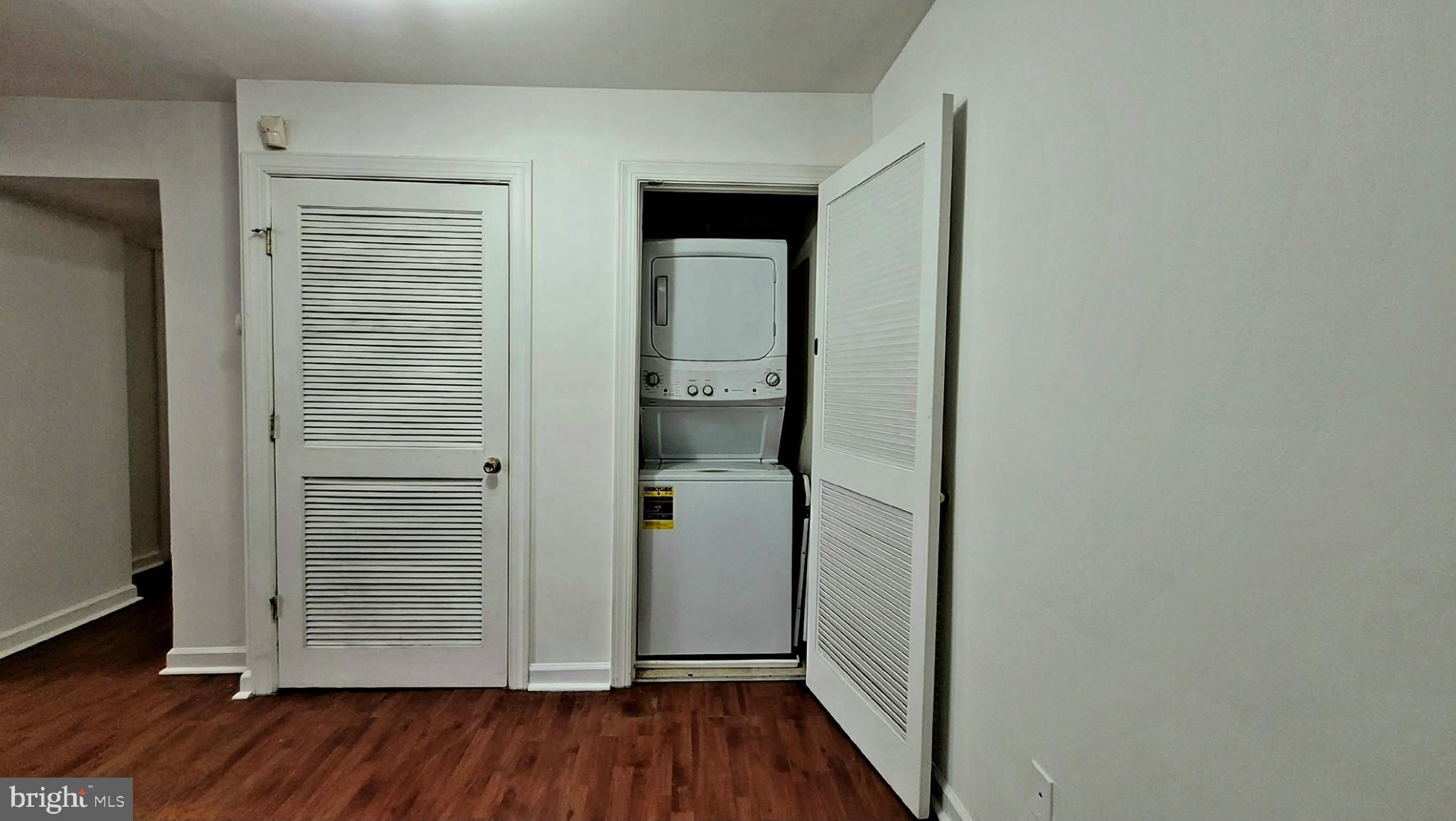705 Brandywine Street Southeast, Unit 201 Washington, DC 20032 - Photo 6 of 15 a view of a hallway with wooden floor