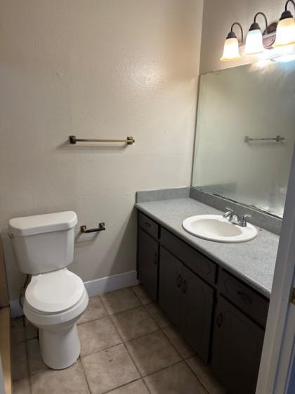 409 Skyline Circle Lorena, TX 76655 - Photo 5 of 16 a bathroom with a sink toilet and vanity