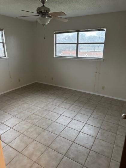 409 Skyline Circle Lorena, TX 76655 - Photo 6 of 16 an empty room with a ceiling fan and window