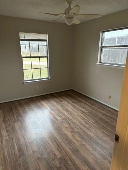 409 Skyline Circle Lorena, TX 76655 - Photo 7 of 16 a view of an empty room with wooden floor and a window