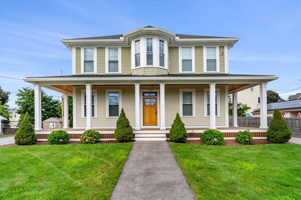 1149 Middlesex Street, Unit 4 Lowell, MA 01851 - Photo 1 of 6 front view of a house with a yard