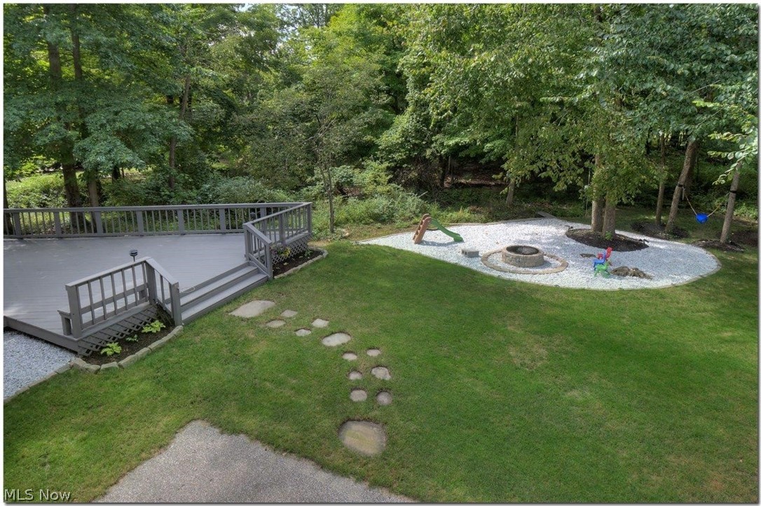 Situated on 1.05 acres. 

Fabulous deck overlooks the large backyard with fire pit and 
wooded views