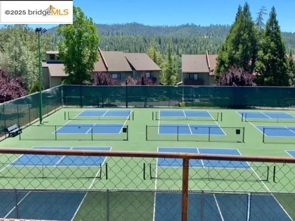 a view of a lake with a house in the background