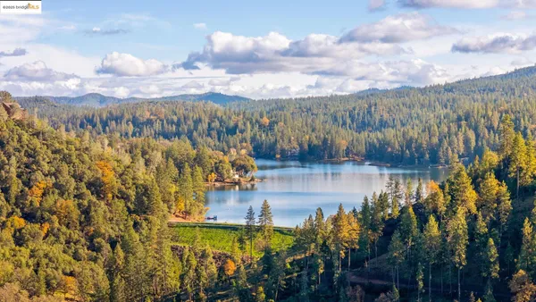 an aerial view of a houses with lake view