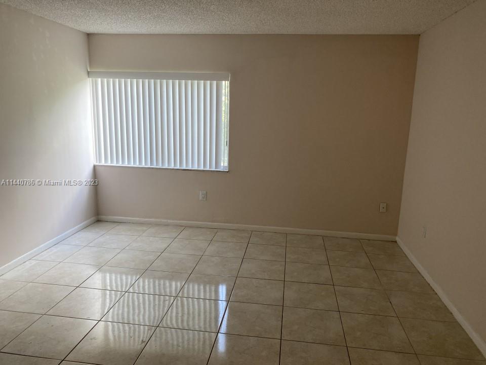 721 North Pine Island Road, Unit 304 Plantation, FL 33324 - Photo 14 of 22 a view of an empty room with a window