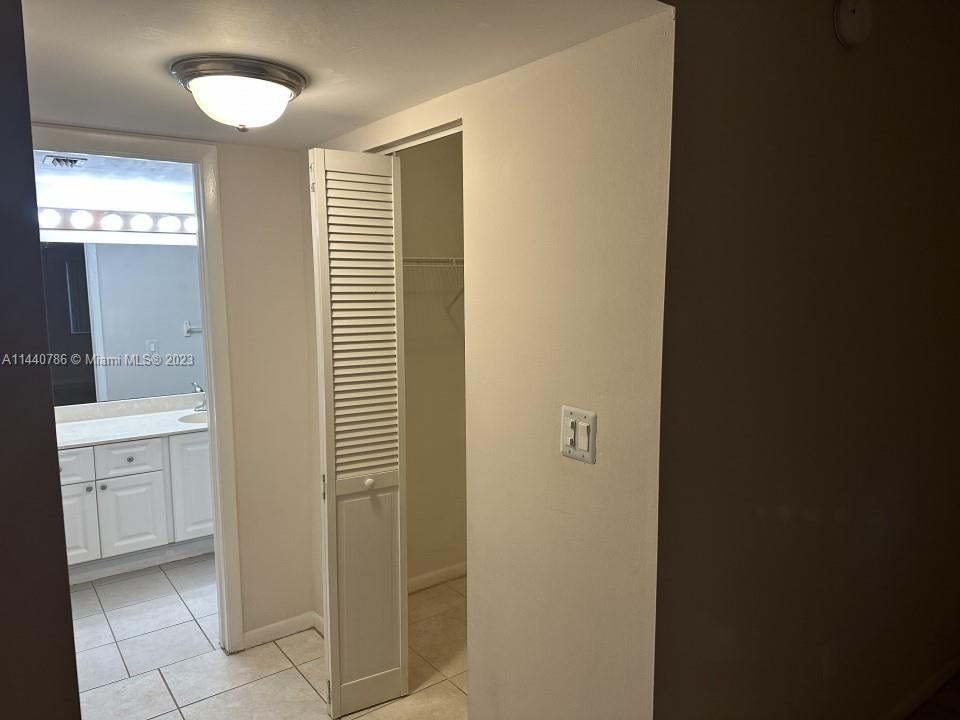721 North Pine Island Road, Unit 304 Plantation, FL 33324 - Photo 22 of 22 a bathroom with a sink and a mirror