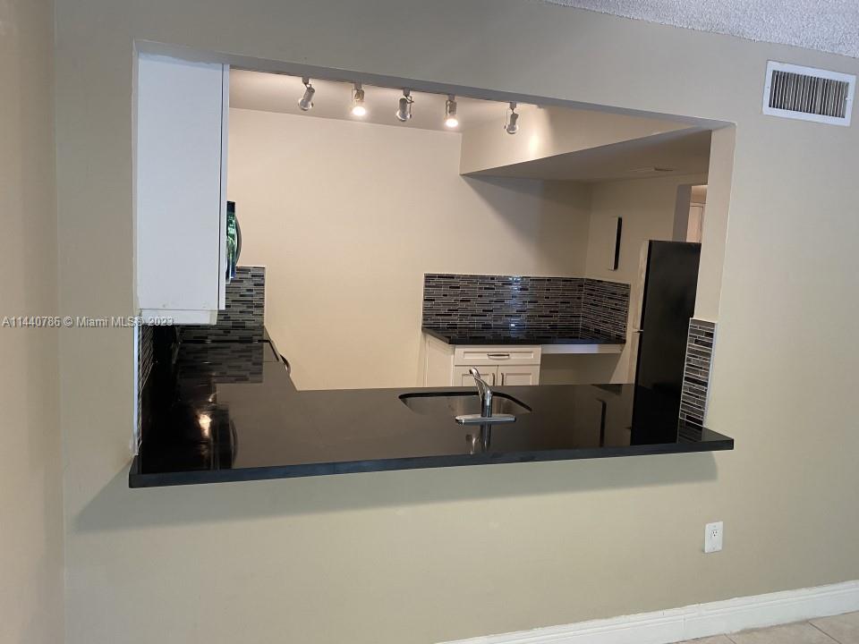 721 North Pine Island Road, Unit 304 Plantation, FL 33324 - Photo 4 of 22 a bathroom with a mirror