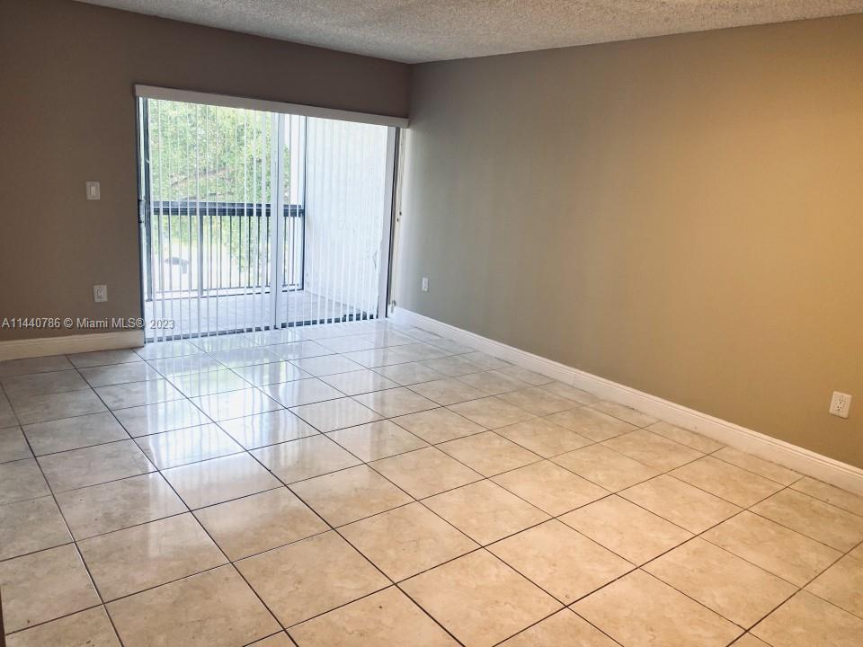 721 North Pine Island Road, Unit 304 Plantation, FL 33324 - Photo 8 of 22 a view of an empty room and a window