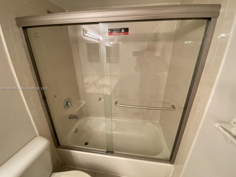 721 North Pine Island Road, Unit 304 Plantation, FL 33324 - Photo 9 of 22 a bathroom with a shower