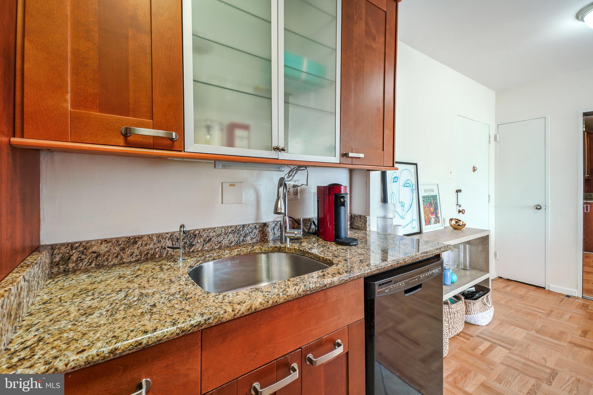 2475 Virginia Avenue Northwest, Unit 728 Washington, DC 20037 - Photo 14 of 32 a kitchen with sink and cabinets