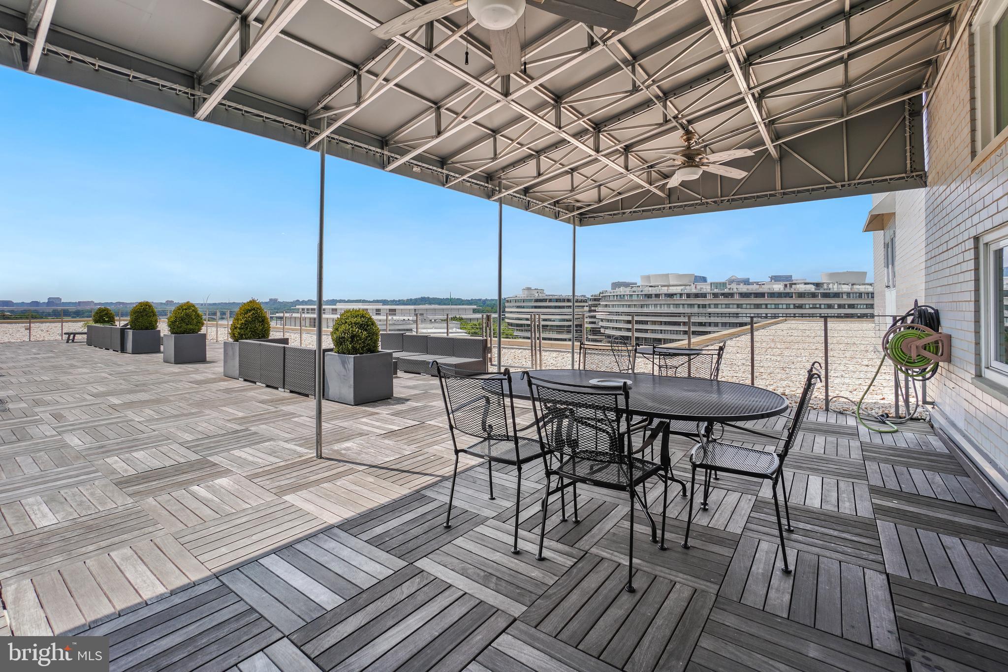 2475 Virginia Avenue Northwest, Unit 728 Washington, DC 20037 - Photo 21 of 32 a view of a chairs and table on the terrace