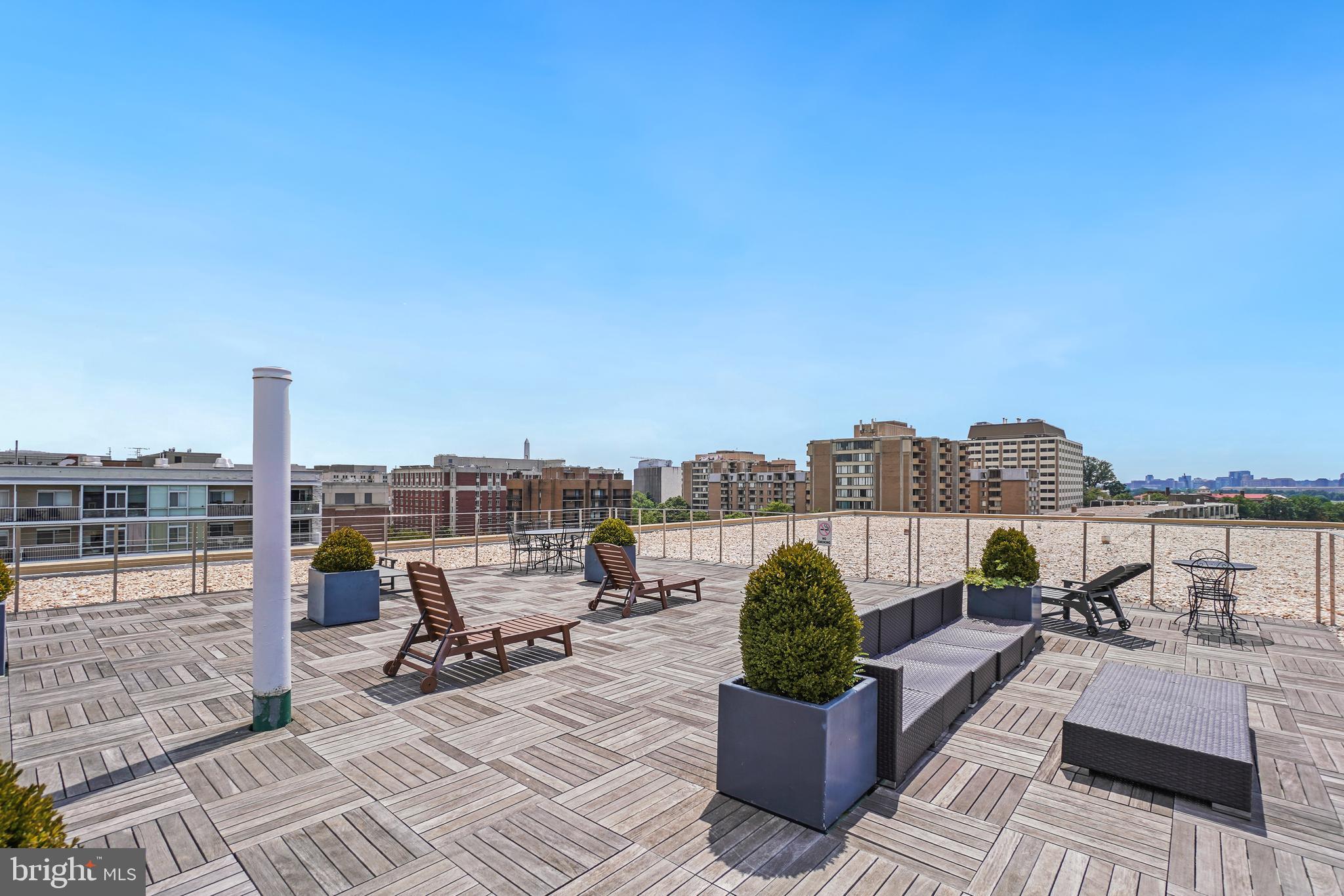 2475 Virginia Avenue Northwest, Unit 728 Washington, DC 20037 - Photo 22 of 32 a view of a terrace with seating space