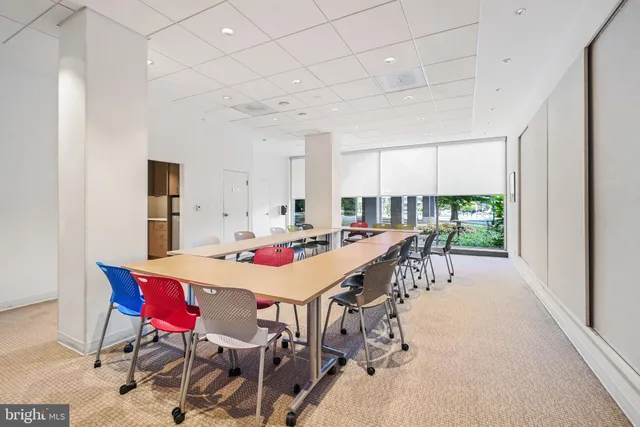 a view of a dining room with furniture and window