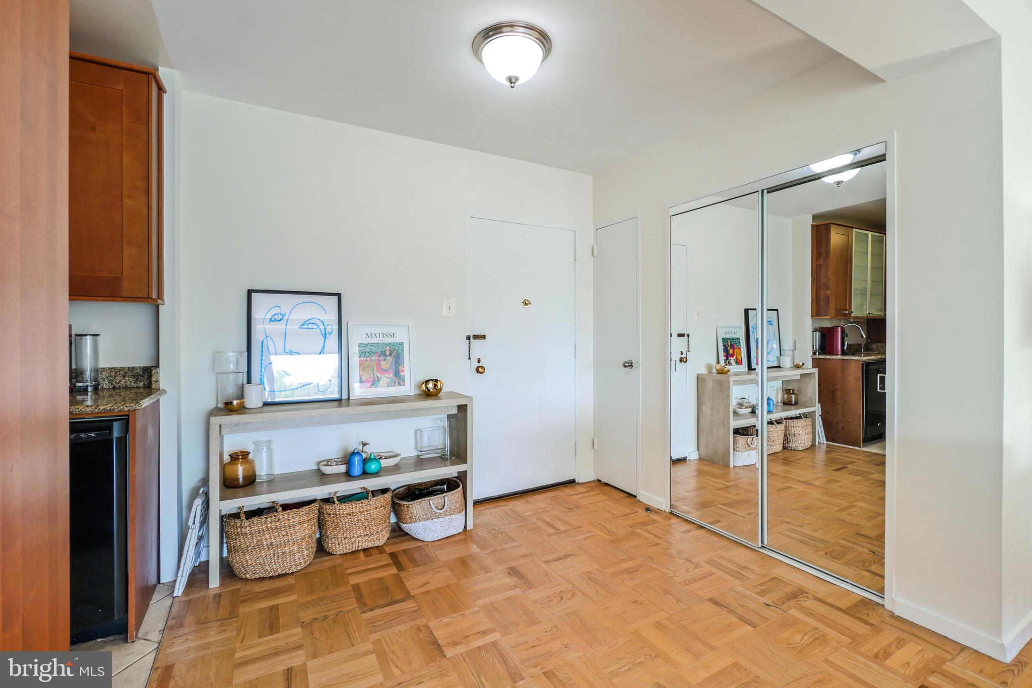 2475 Virginia Avenue Northwest, Unit 728 Washington, DC 20037 - Photo 4 of 32 a living room with furniture and a flat screen tv