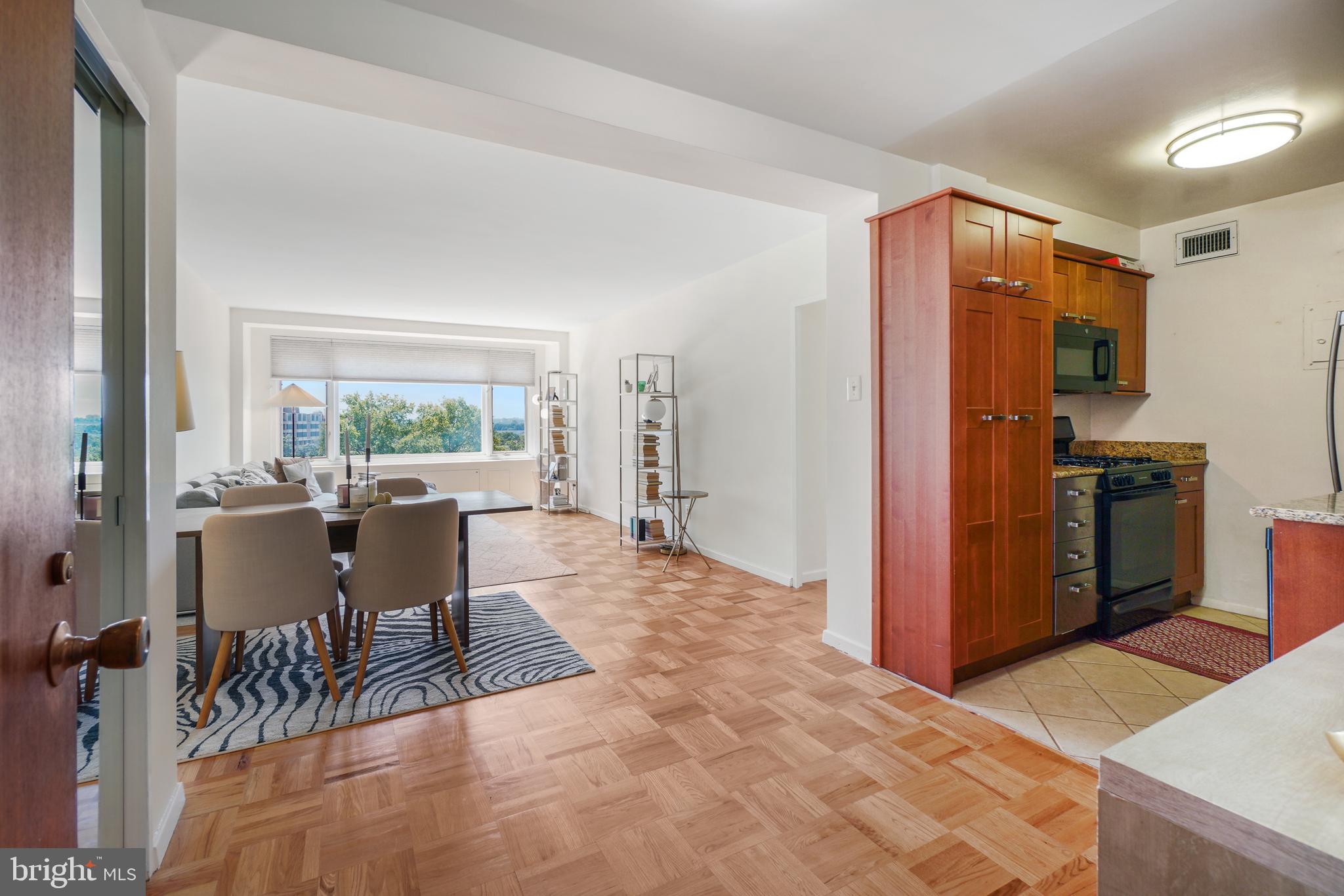 2475 Virginia Avenue Northwest, Unit 728 Washington, DC 20037 - Photo 10 of 32 a view of a dining room with furniture window and outside view
