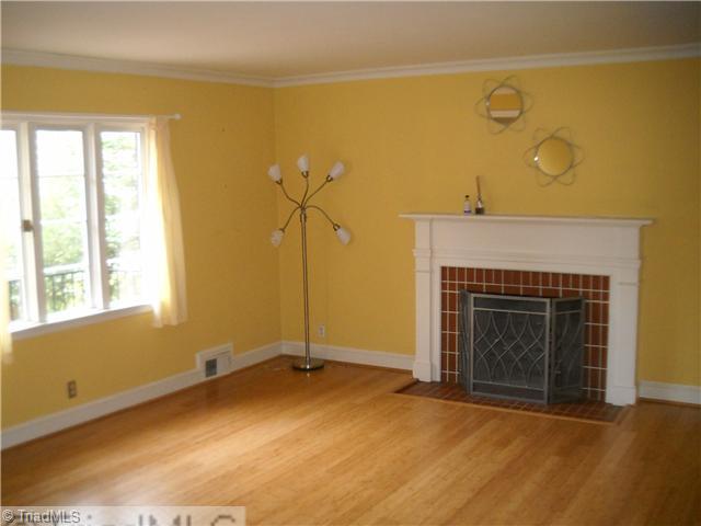 634 Colonial Drive High Point, NC 27262 - Photo 2 of 16 Living Room. Living room is spacious and opens to the dining room. Accented by a working fireplace.