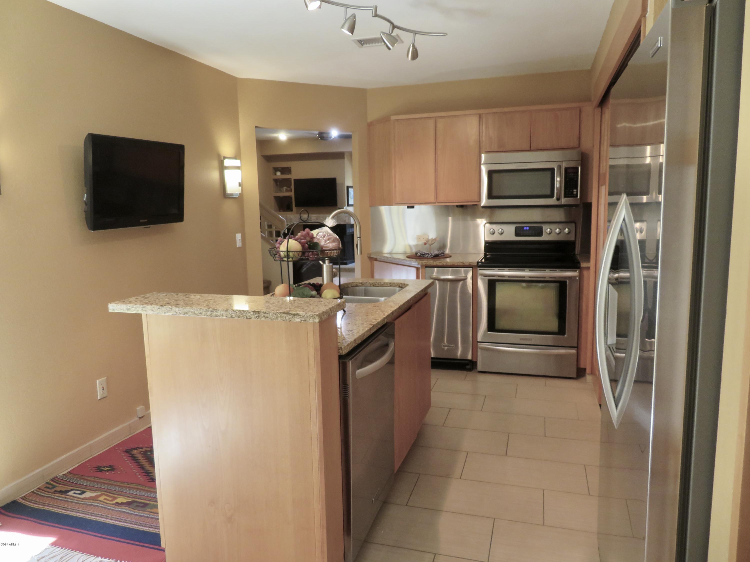 7272 East Gainey Ranch Road, Unit 126 Scottsdale, AZ 85258 - Photo 12 of 56 STAINLESS APPLIANCES