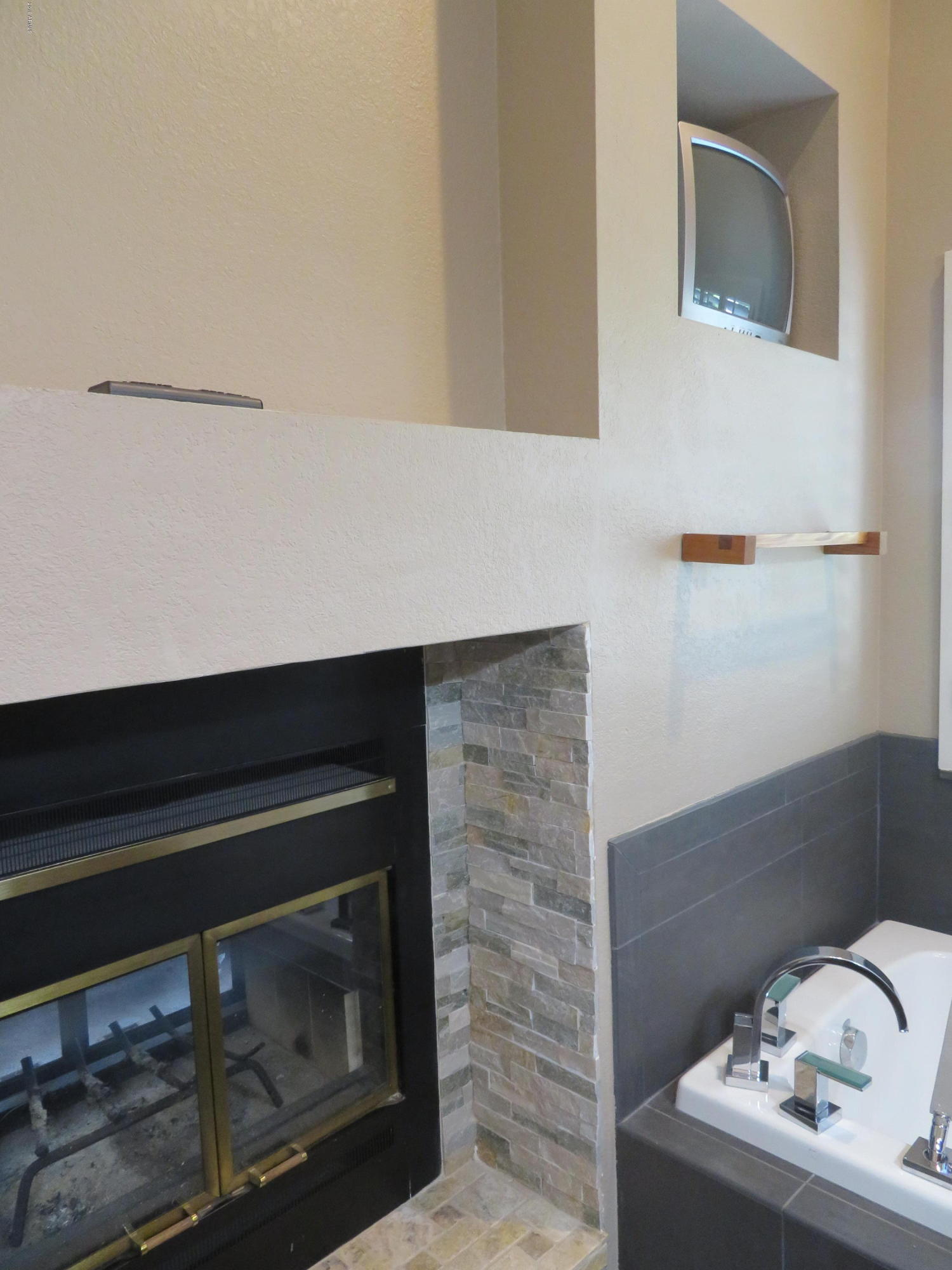 7272 East Gainey Ranch Road, Unit 126 Scottsdale, AZ 85258 - Photo 28 of 56 FIREPLACE IN MASTER BATH